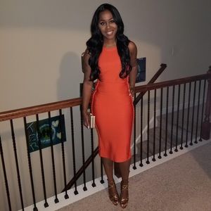 Orange cutout side midi dress